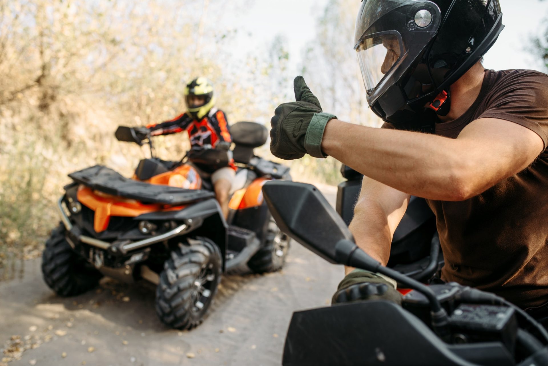 atv-rider-showing-thumbs-up-to-his-partner-e1645282496760.jpg